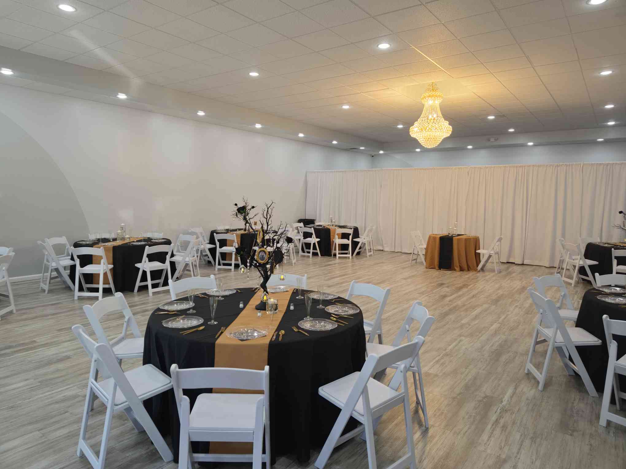 Wide room setup for a celebration at Event Palace